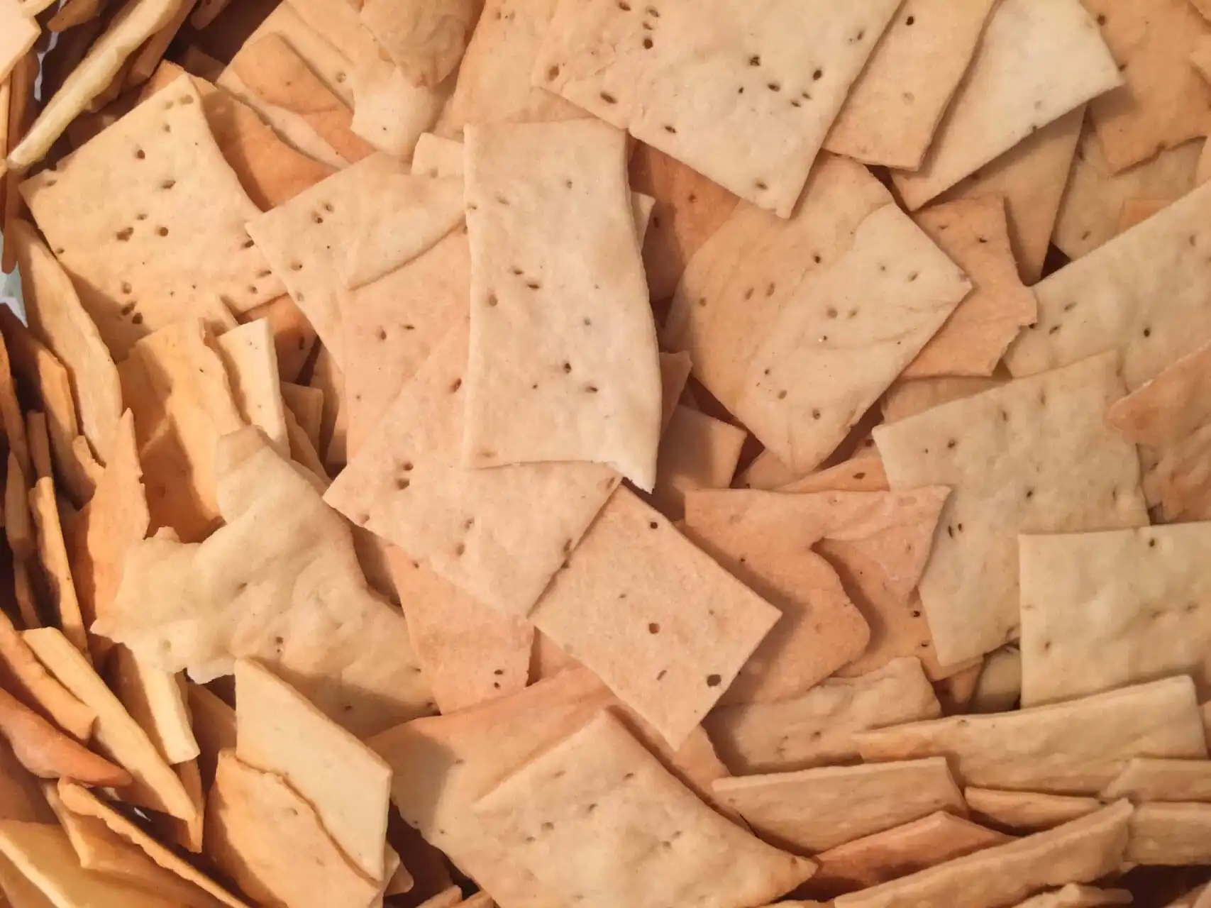 Assorted crispy Jacks Crackers in a basket, perfect for snacking.